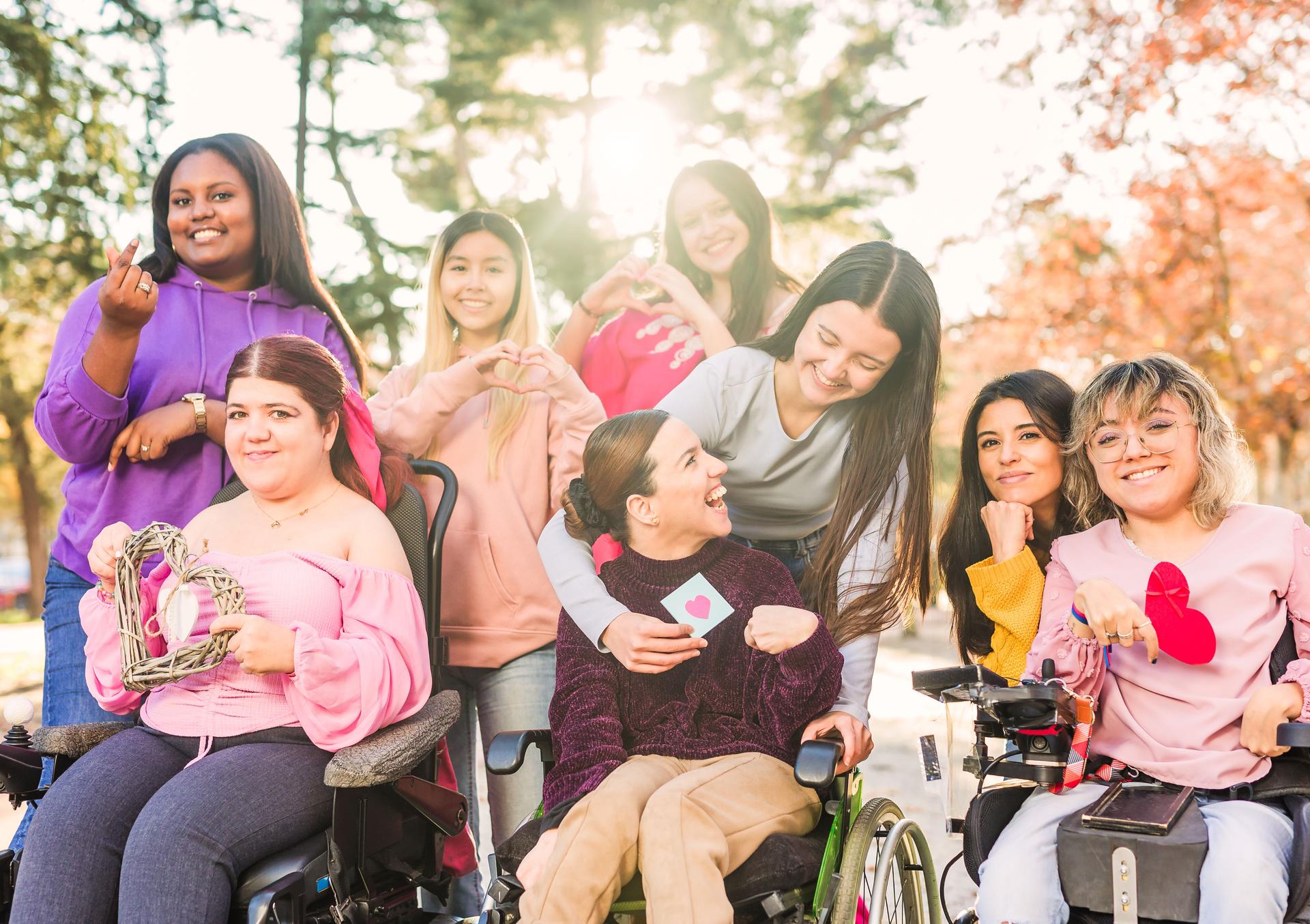 InspireInclusion international womens day. Multiethnic group do heart love hand gesture. Disability